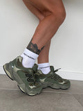Thick. durable 1/4 socks with comfortable padded footbed, ribbed upper and stitched black PEPPAMINT logo placed horizontal on upper sock