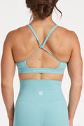 women's moderate support activewear bra in buttery soft fabric with stunning triangle open back detail and scoop neckline