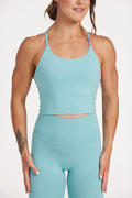crop singlet with thin cross back straps and built in shelf bra in lagoon green