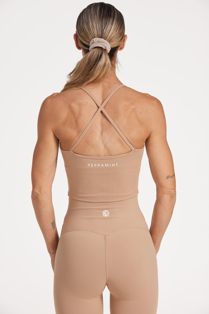 high waisted buttery soft, supportive activewear tights and crop singlet with built in shelf bra in a light taupe colour