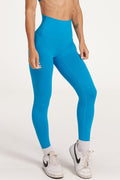 high waisted buttery soft, supportive activewear tights, with no front rise seam in blue coral