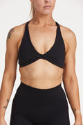 twist front bra with cross over back straps in a buttery soft black fabric