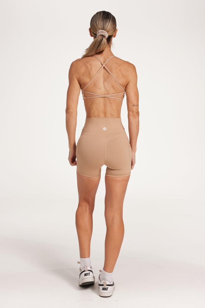 twist front bra with cross over back straps in a buttery soft fabric in a light taupe colour
