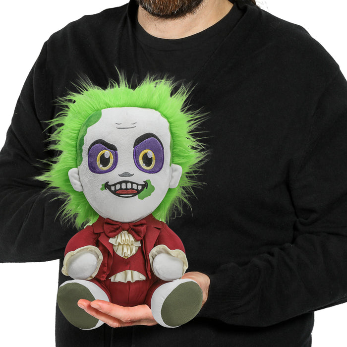 Kidrobot Beetlejuice HugMe plush in red suit with shake action, featuring detailed character design and soft, cuddly texture.
