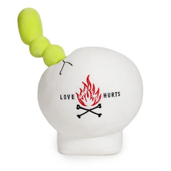 Interactive plush toy featuring a giant skull and worm by Kidrobot, designed by Travis Cain, soft and detailed for play and display.