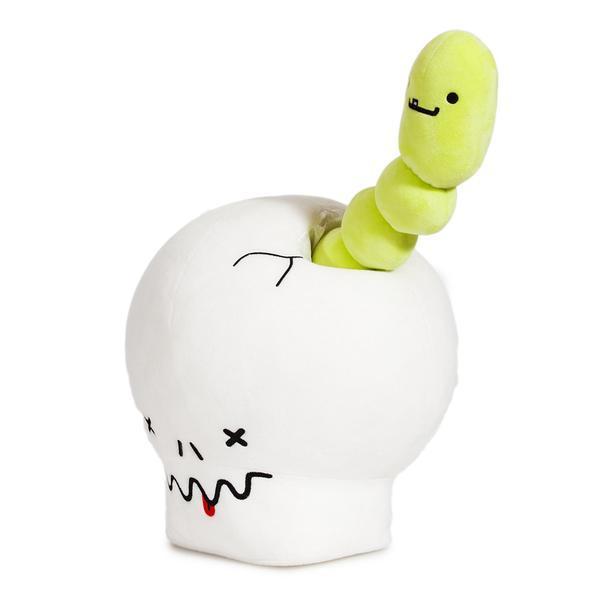 Interactive plush toy featuring a giant skull and worm by Kidrobot, designed by Travis Cain, with detailed plush textures.