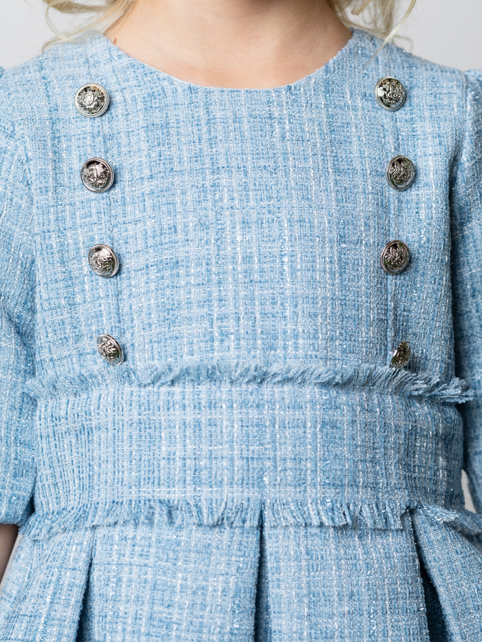 Gold button detail on girls blue graduation dress