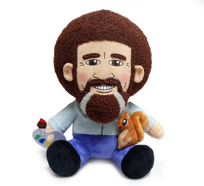 Bob Ross HugMe plush toy featuring Peapod the squirrel, soft and cuddly with detailed embroidery of Bob Ross's face and Peapod.