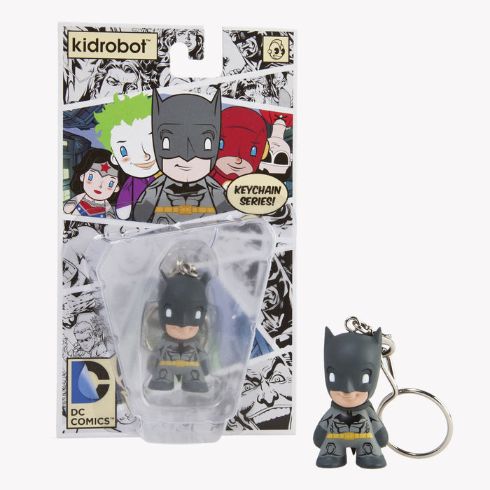 Gray vinyl Batman keychain from Warner Bros. DC Universe featuring a metal keyring with Batman logo and detailed design.