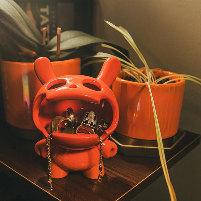 Sunset orange Kidrobot Fine Ash Dunny 5-inch ceramic ashtray figure with detailed design and compact shape.