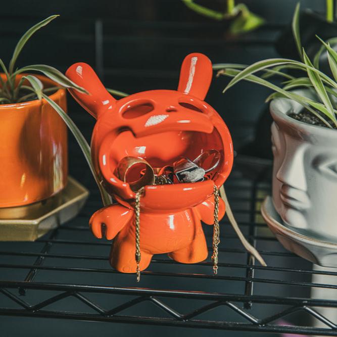 Sunset Orange Kidrobot Fine Ash Dunny 5-inch ceramic ashtray figure with detailed design and vibrant color.