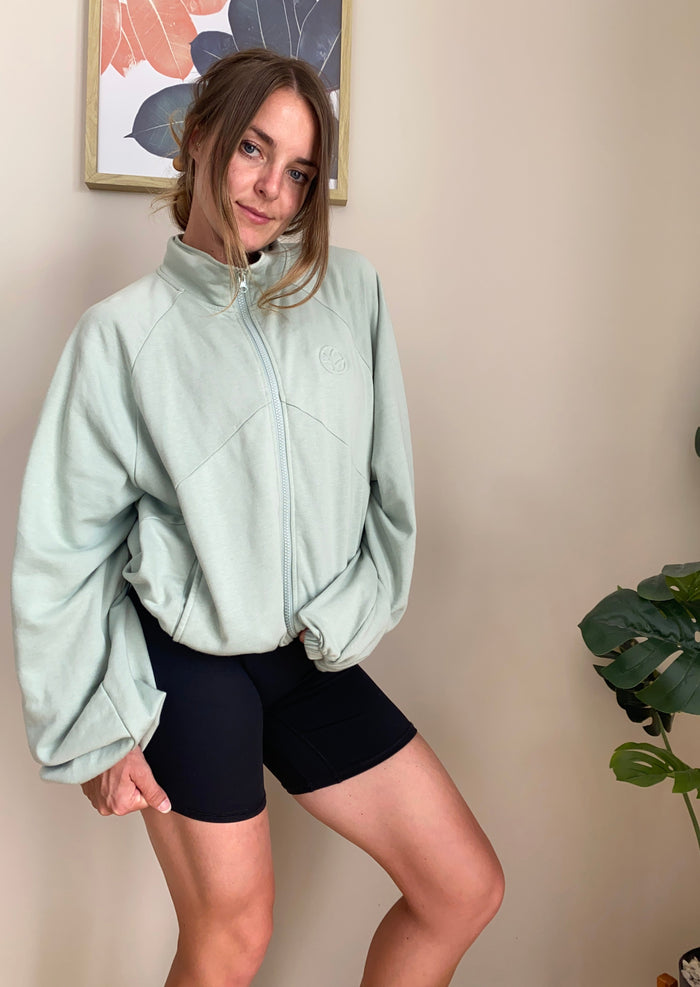 French terry cotton zip jacket with embossed logo, drawstring adjustable hem, oversize sleeves in sage green