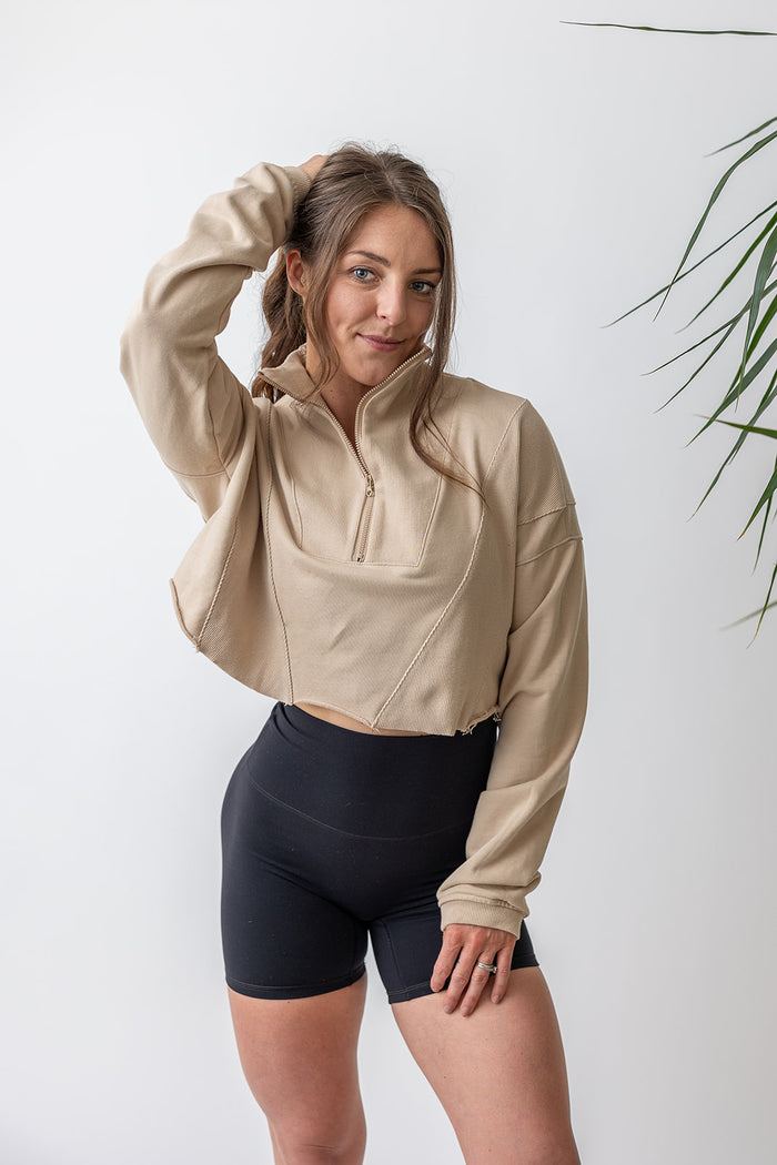 french terry cotton crop jacket with ribbed panels, raw edge hem and iconic embossed logo with half zip