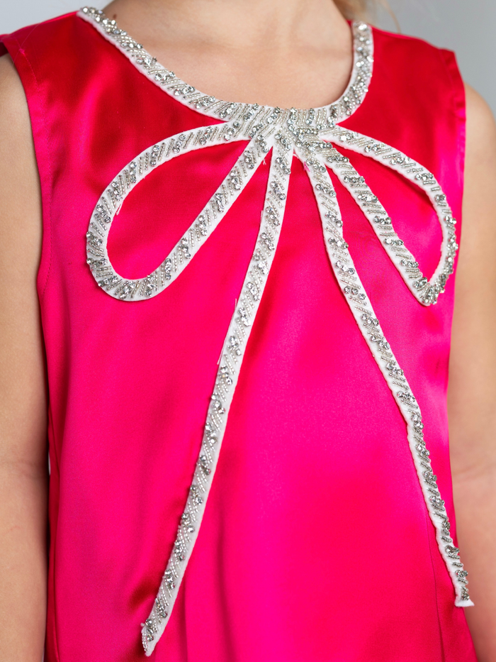 Girls birthday party dress in hot pink with bow detail