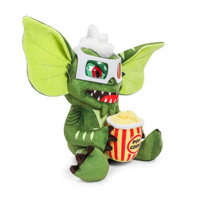 Gremlins Stripe HugMe plush with popcorn design, 14.5-inch shake-action plush toy featuring Gremlins branding and colorful stripe pattern.