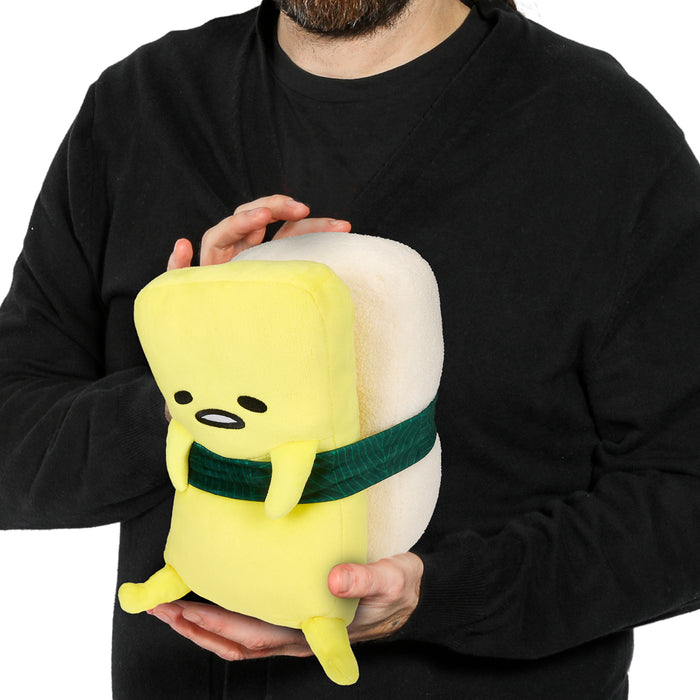 Sanrio Gudetama Tamago 10-inch plush toy featuring a soft, yellow egg character with a relaxed expression, by Kidrobot.