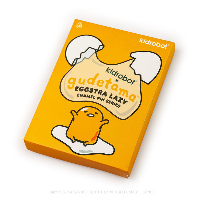 Gudetama Eggstra Lazy enamel pin from Kidrobot x Sanrio, featuring a cute, relaxed egg character in a single blind box design.