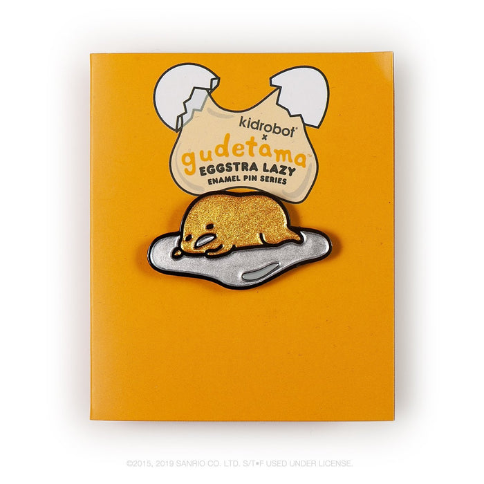 Gudetama Eggstra Lazy enamel pin from Kidrobot x Sanrio, featuring a cute, relaxed egg character in a single boxed pin design.