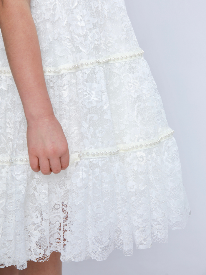 Ivory skirt close up showing intricate lace texture