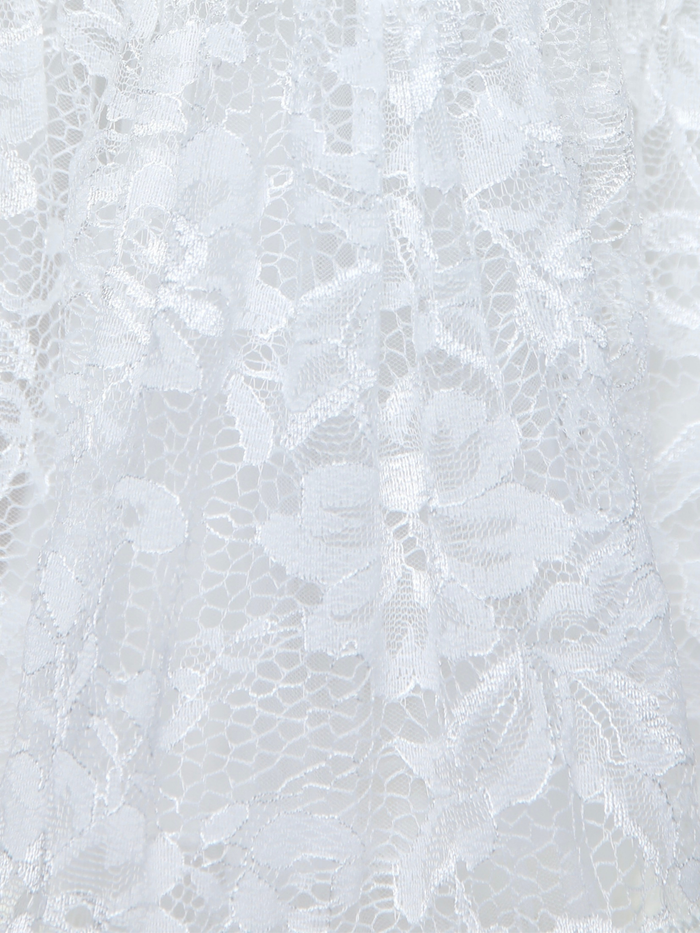 Close up of ivory lace skirt with floral textured pattern