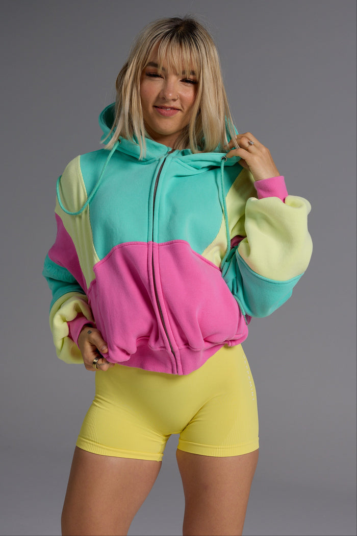 Hip length, full zip hoodie, with ribbed panels, embossed sleeve logo, in a slouchy oversize fit, with 2 convenient zip pockets, in neon pink, green and yellow.