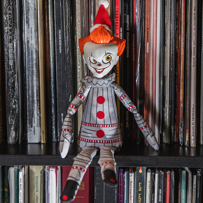 IT Holiday Horribles Pennywise plush toy, 8-inch Roto Phunny plush from the IT 2017 movie, featuring Pennywise in festive attire.