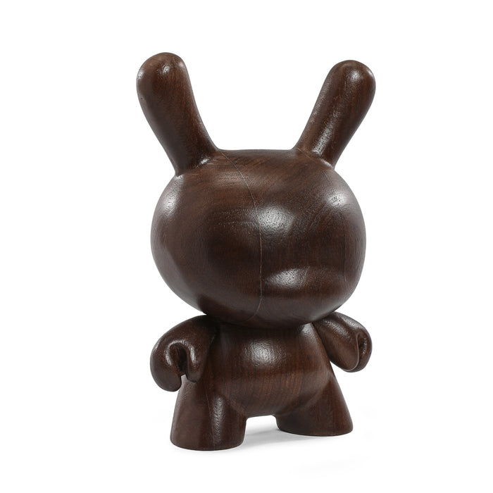 Kidrobot RAW Black Walnut 8-inch limited edition Dunny figure made of wood, with detailed craftsmanship and a sleek black walnut finish.