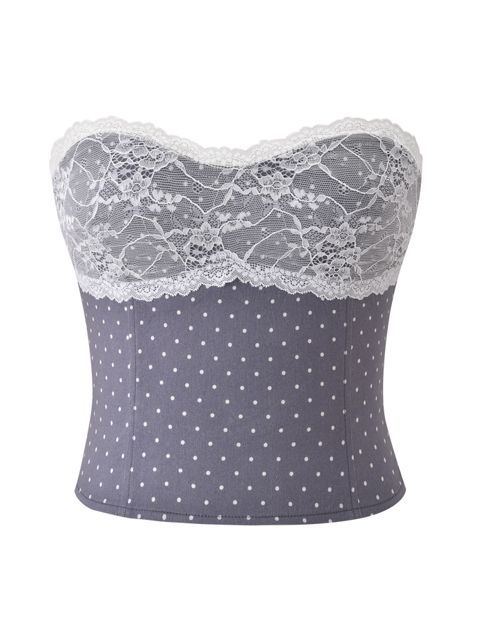 The KITTIE LACE CORSET - GREY DOT by TIGERMIST is a strapless top in grey and white polka dots, finished with a scalloped white lace trim along the sweetheart neckline.