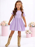 Girls spring dress in lavender with bow sleeve accents