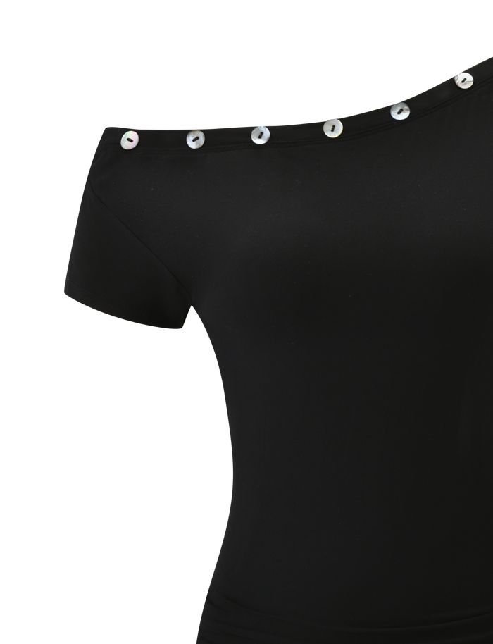 The MARITA DRESS - BLACK by TIGERMIST features an off-shoulder design, short sleeves, an asymmetrical neckline, and shiny round buttons along the collar.