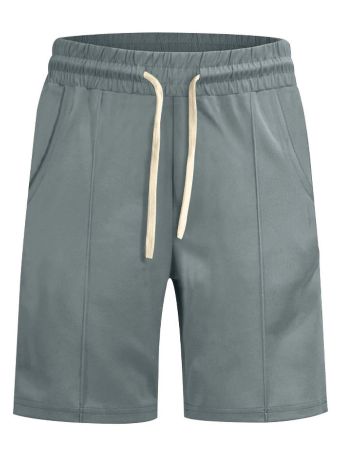 Green shorts with a drawstring on a white background