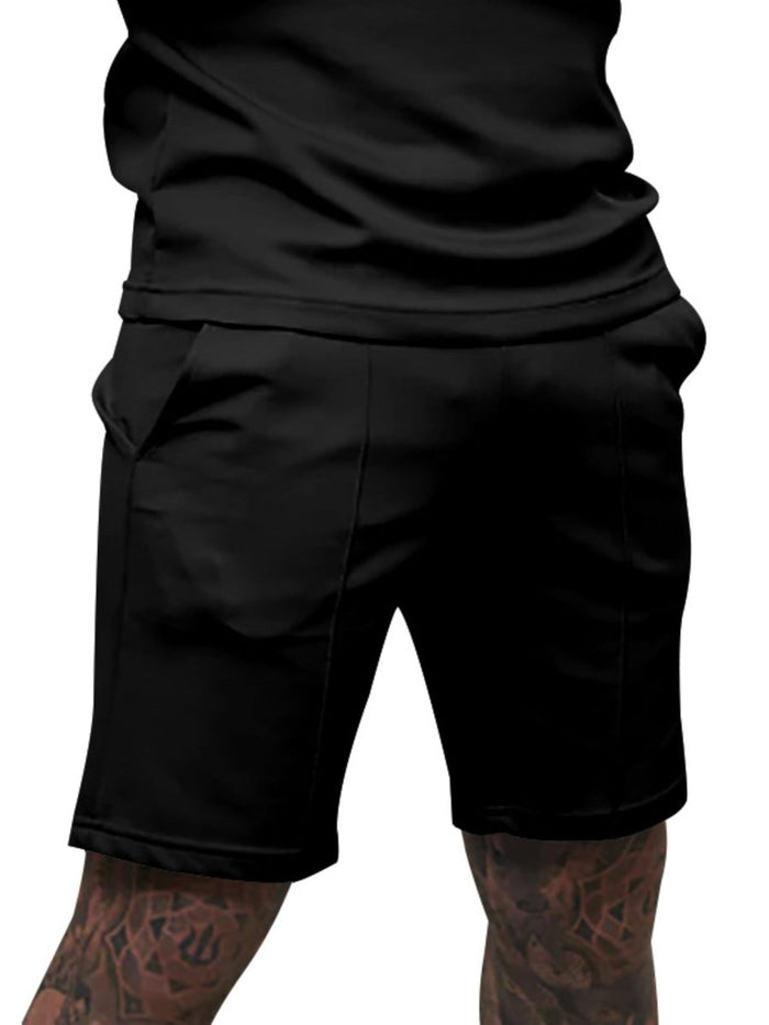 Black shorts worn by a person on a white background