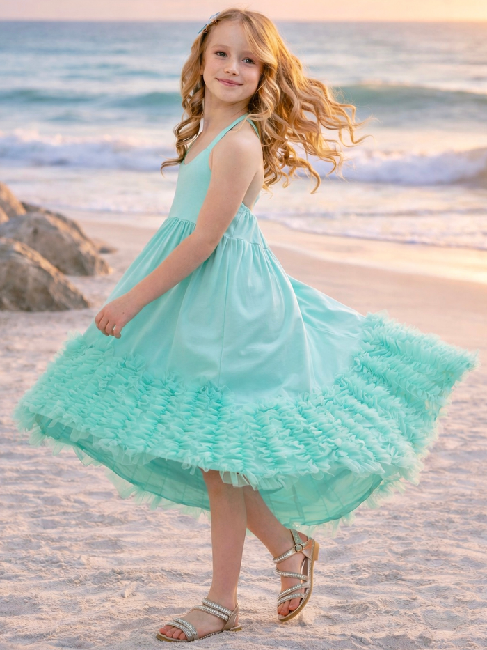 Little girl in halter dress with layered ruffle hem detail