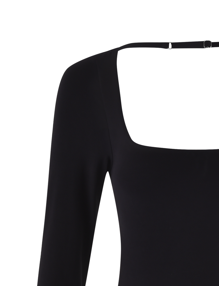 A close-up of the TIGERMIST MINERVA LONG SLEEVE BODYSUIT - BLACK, featuring a bodycon fit, square neckline, and thin strap detail across the upper back. The smooth fabric accentuates its sleek silhouette.