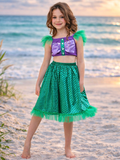 Girl wearing ocean inspired skirt set with shimmer top and tulle skirt