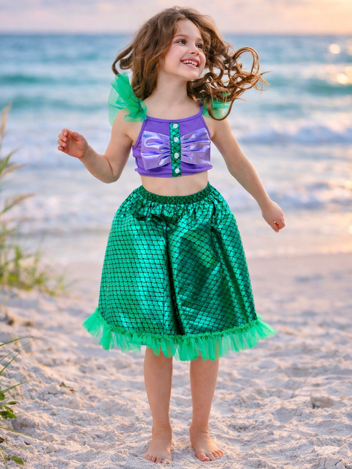 Girl wearing sparkle skirt set with colorful top and tulle hem