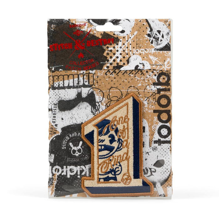 Kidrobot Stitch & Destroy patch featuring unique design, colorful embroidery, and detailed stitching on fabric background.