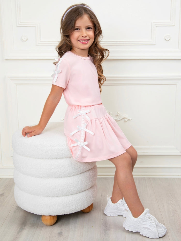 Girls pink pleated skirt set with lace bow details