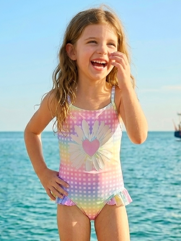Girls vacation swimsuit with bright colors and ruffle accents