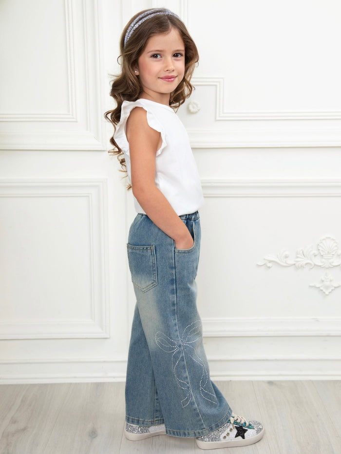 Medium wash girls jeans with rhinestone bow accents
