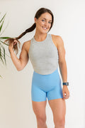 ribbed crop top in grey marl with curved edge hem and subtle logo stitched tag