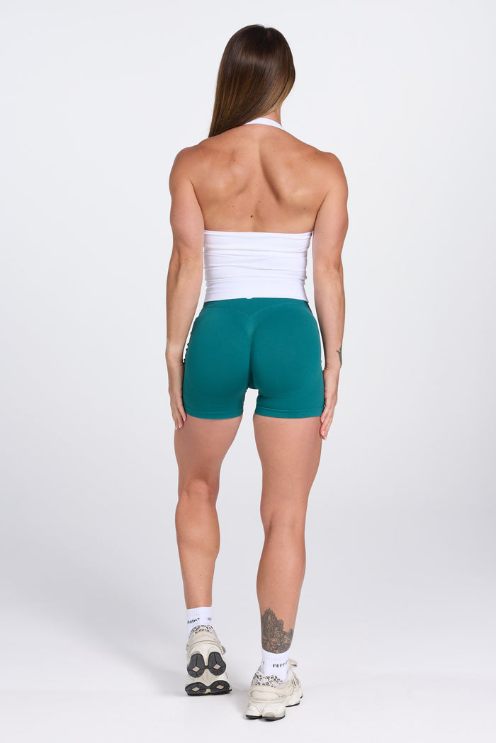 Seamless halter neck tank top, with supportive built in bra, U neck design and open back, with PEPPAMINT centre chest branding in white
