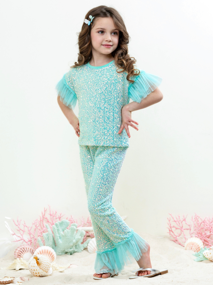Little girl in seafoam green shimmer outfit with matching pants