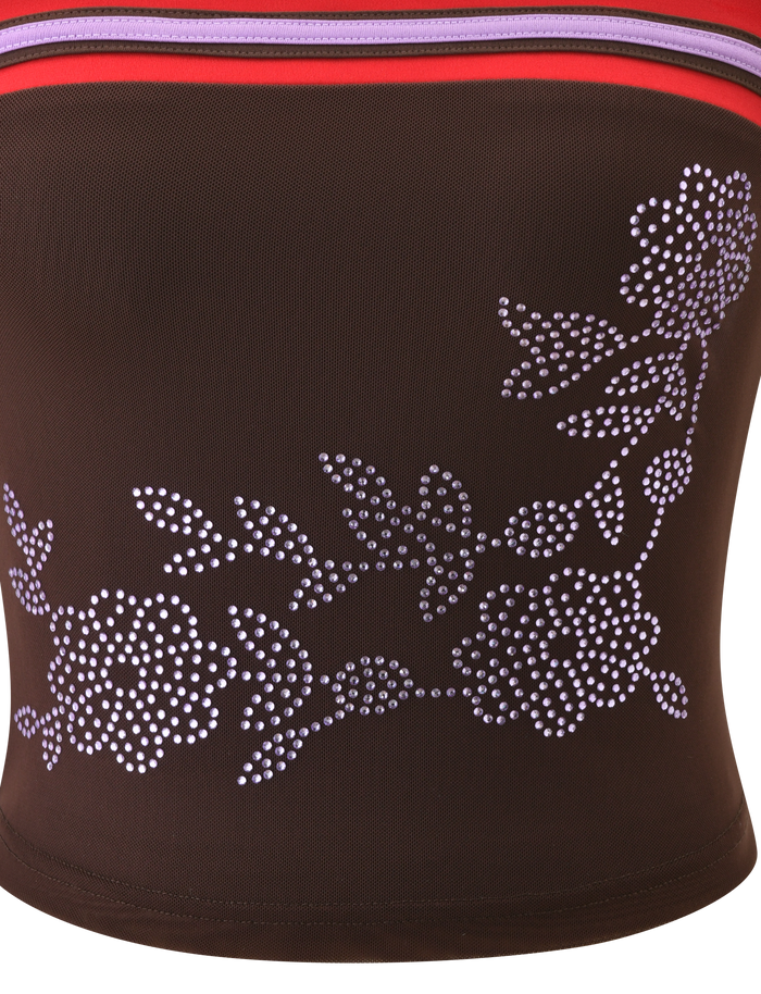 A close-up of TIGERMIST's SERAH DIAMANTE BOOB TUBE - CHOCOLATE shows chocolate brown fabric with white dotted floral patterns and red, purple, and pink stripes—ideal for a chic and stylish mesh look.