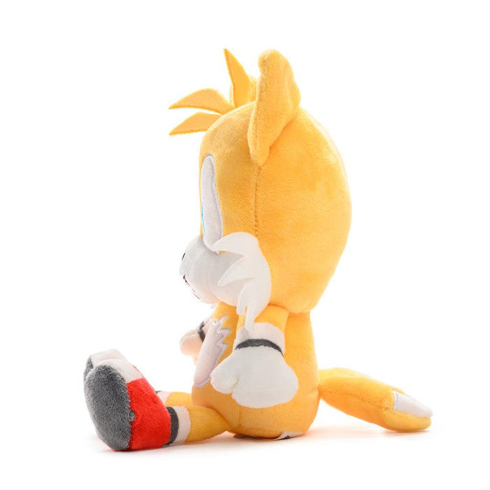 Sonic the Hedgehog Tails plush toy by Kidrobot, soft and cuddly, featuring Tails' orange fur, big eyes, and fluffy tails.