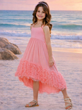 Girl wearing coral high low dress with layered ruffle hem for summer