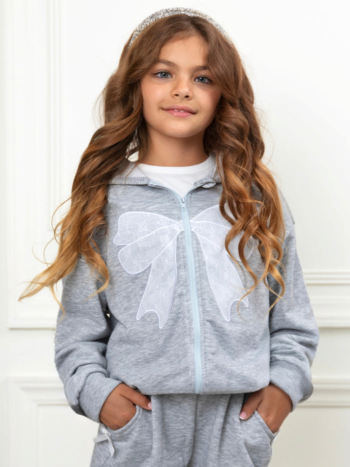 Girls casual outfit with oversized bow detail and wide leg pants