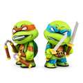 Teenage Mutant Ninja Turtles 3-inch vinyl figures of Leonardo and Michelangelo in a 2-pack, featuring detailed character designs.