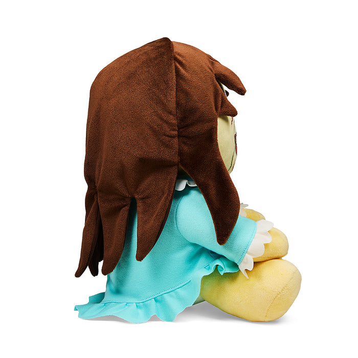 Medium plush of Regan from The Exorcist by Kidrobot, featuring detailed facial features and iconic costume.