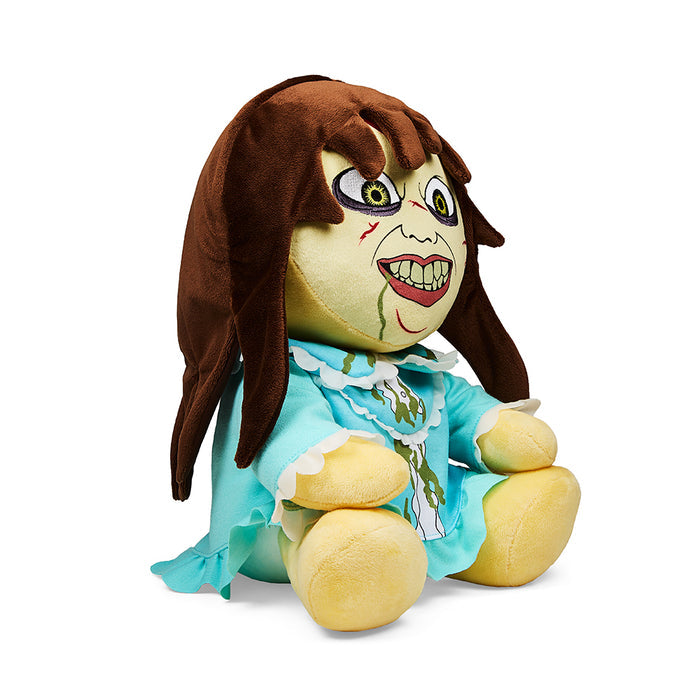 Medium plush of Regan from The Exorcist by Kidrobot, featuring detailed face and iconic costume, perfect for fans and collectors.